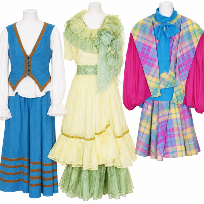 Three restored Hello Dolly costumes for Irene and Ermengarde in blue, yellow-green and plaid
